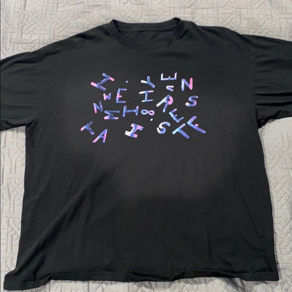 Black short sleeved shirt with scattered letters